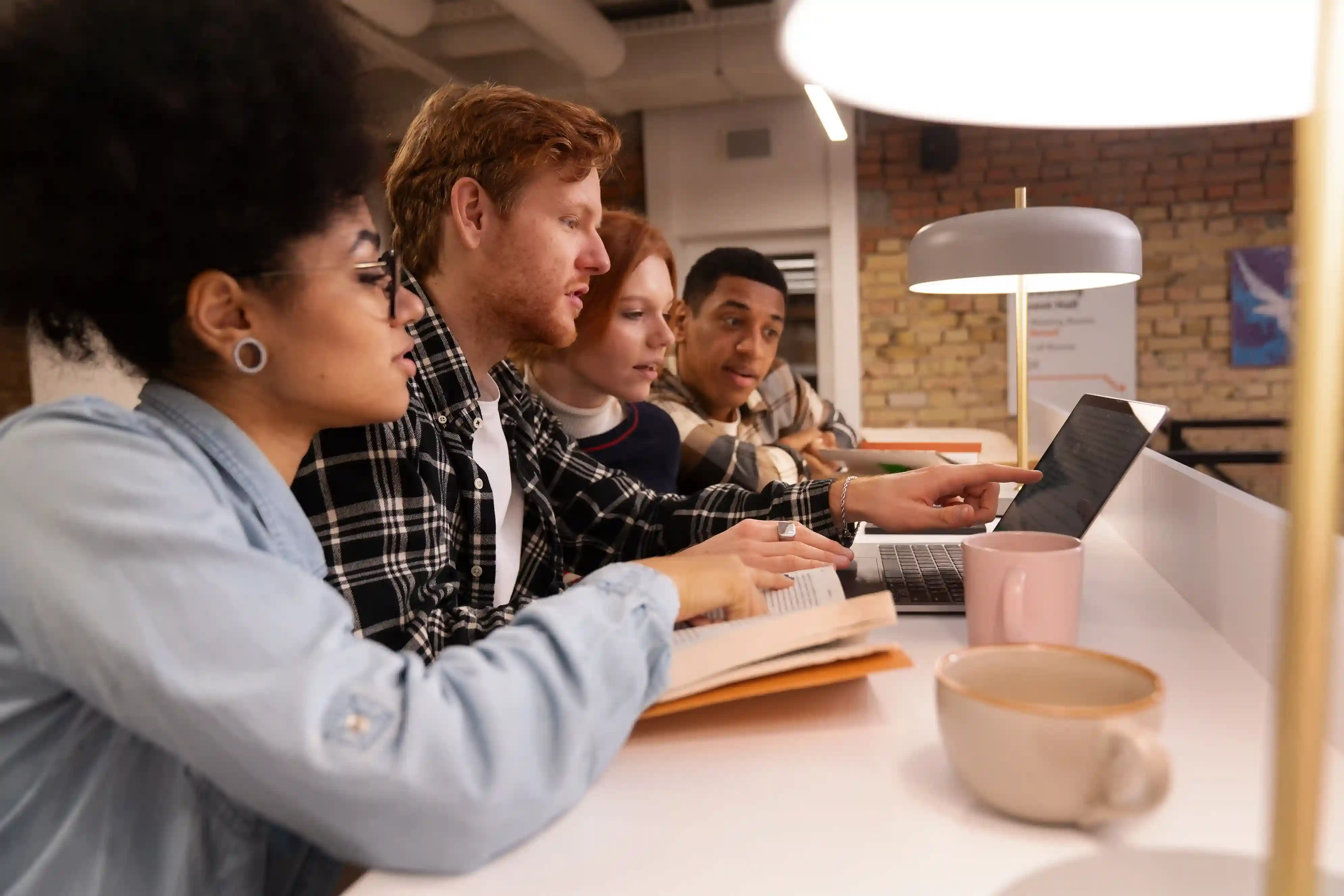 Students high-fiving in front of university