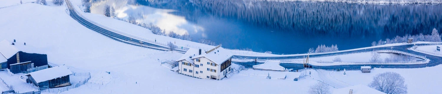 Students collaborating in a modern classroom with laptops