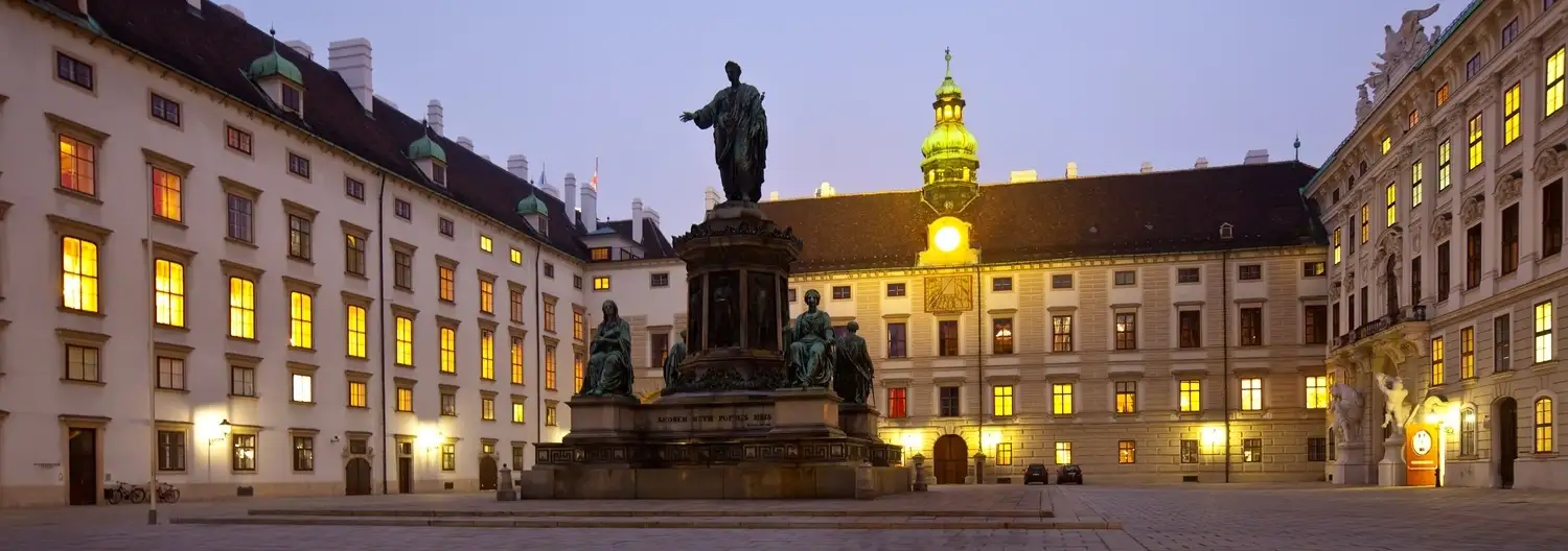 Students collaborating in a modern classroom with laptops